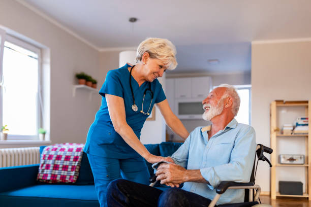 istock Carer caring for senior man 1184367417