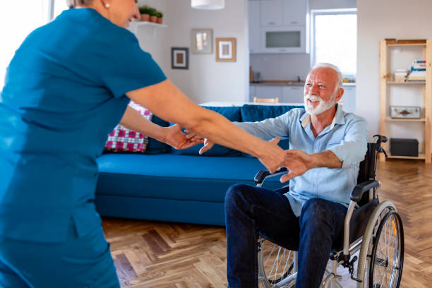 istock Receiving professional, compassionate, and personalized care. Carer helping an elderly man in a wheelchair 1184367883