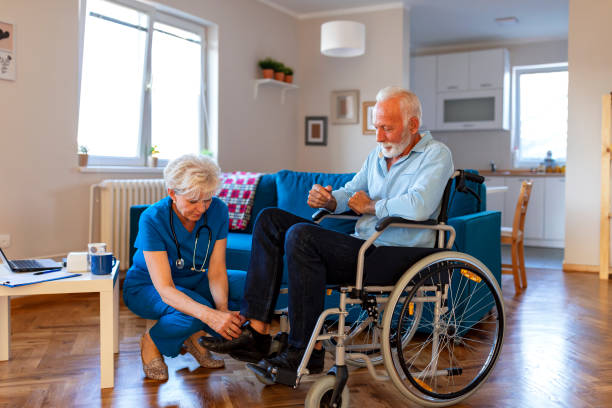 istock Nurse helping senior man on wheelchair 1184367945