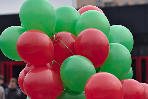 istock bunch of red and green balloons 1184368083