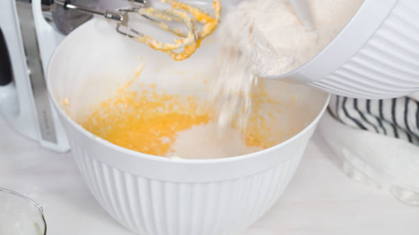 istock Mixing batter to bake vanilla cupcakes 1184368523