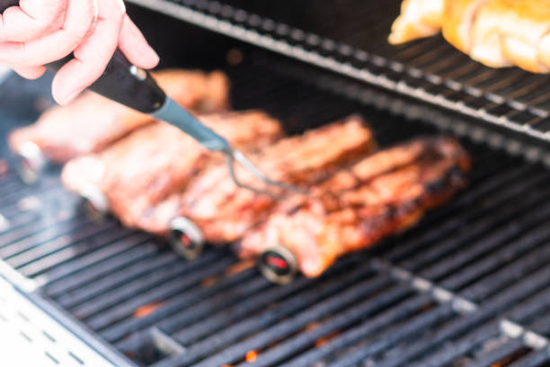 istock Grilling New York strip steak 1184370178