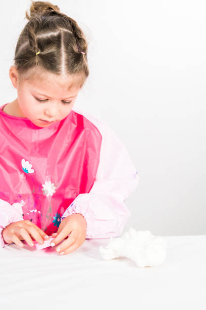 istock Little girl modeling mermaid tails 1184371354