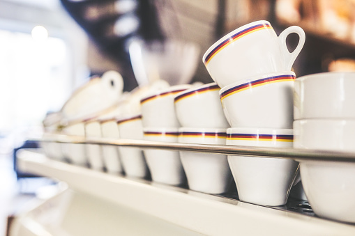 Closeup shot of a stack of empty cups in a cafe