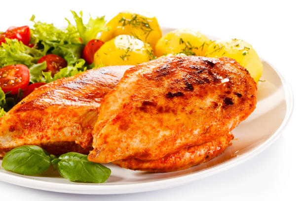 istock Grilled chicken fillets with vegetable salad 1184373143
