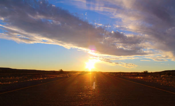 istock Sunset sky and road in the desert 1184373451