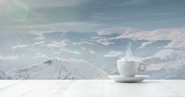 istock Single tea or coffee cup and landscape of mountains on background 1184373478