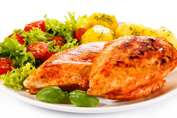 istock Grilled chicken fillets with vegetable salad 1184373535