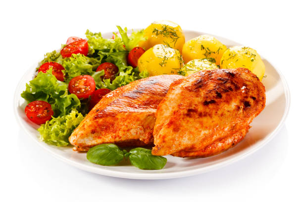 istock Grilled chicken fillets with vegetable salad 1184373759