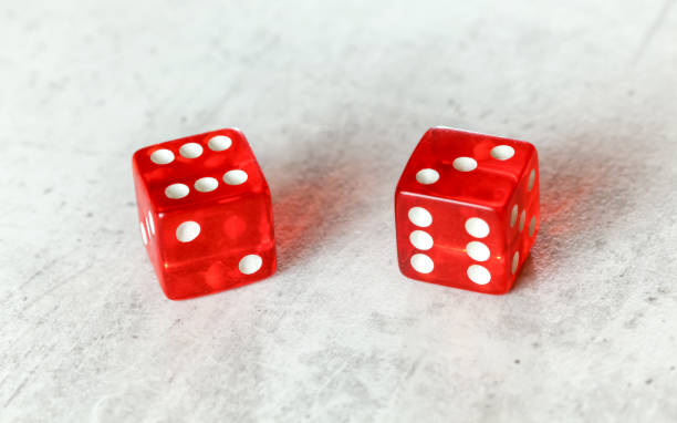 istock Two translucent red craps dices on white board showing Centerfield Nine / Nina (number 6 and 3) 1184374033