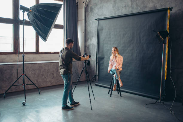 istock daily routine of photographers,working hours at photo studio 1184374799