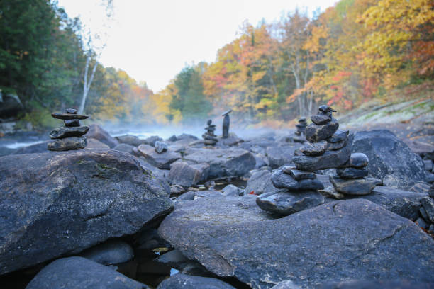 A lot of inukshuks standing on the rocks on algonquin park ontario
