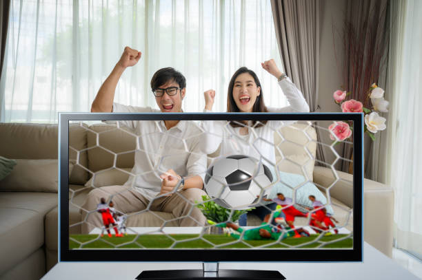 Family 44 couple lover enjoy with cheerfully in football goal winning match together in living home, visual watching football match on screen view football player girlfriend stock pictures, royalty-free photos & images