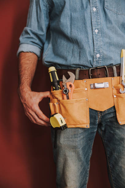 istock Close up of man with tool belt in studio 1184378574