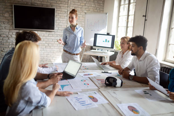 istock Successful business group of people at work in office 1184378961