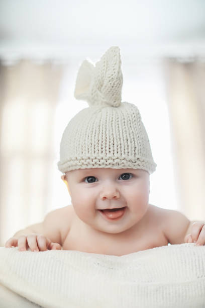 istock A newborn baby is lying on a soft bed. 1184379362