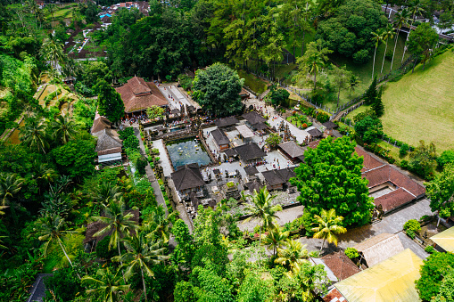 Aerial view of Tirta Empul Temple on Bali. Buddhist temple surrounded by rainforest.