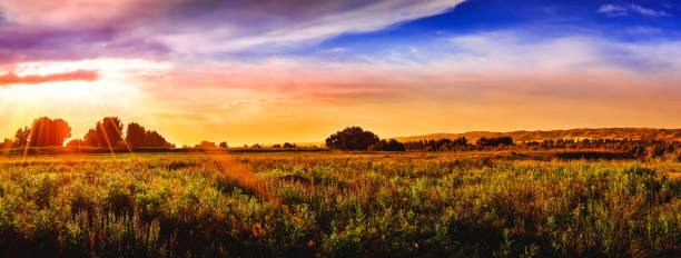 istock Bright sunlight through the clouds against the backdrop of a breathtaking evening, morning sky at sunset, dawn. 1184384228