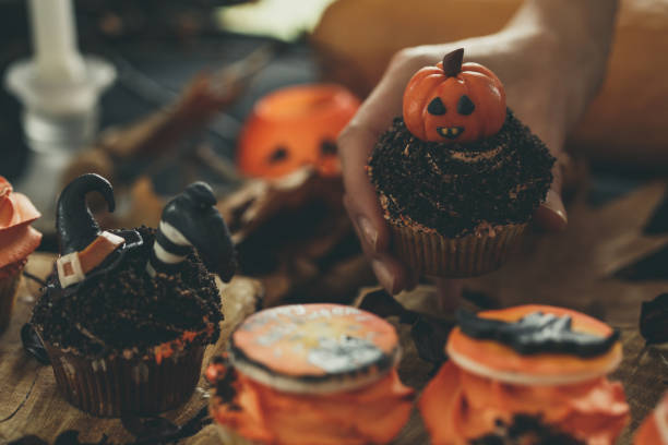 istock Woman arranging Halloween party table 1184386198
