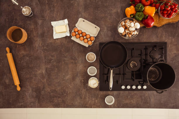 Kitchen counter with ingredients for a meal and pots and pans