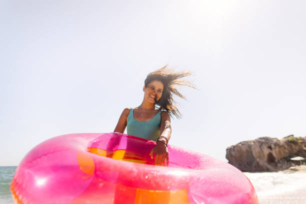 istock Enjoying summer at the beach 1184386603