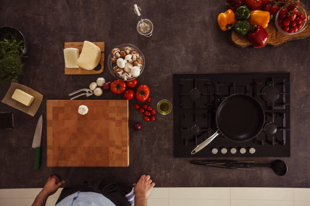 istock Man about to chop fresh garlic 1184387128