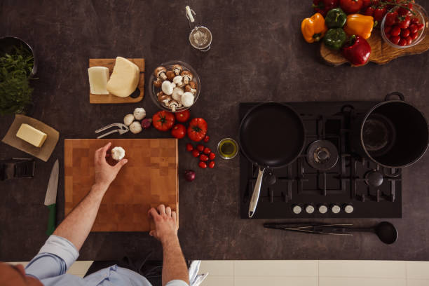 istock Man preparing to chop garlic 1184387129