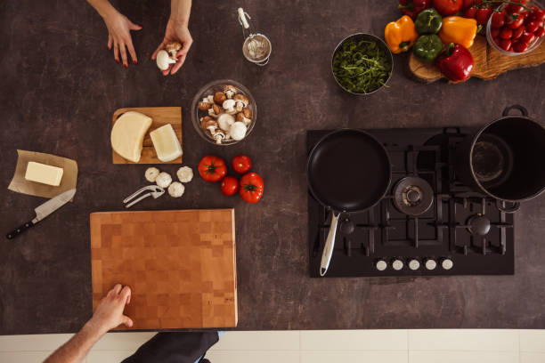 istock Pair of hands preparing ingredients before making a meal 1184387130
