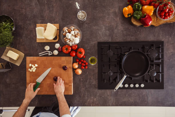 istock Man preparing purple onion for chopping 1184387142