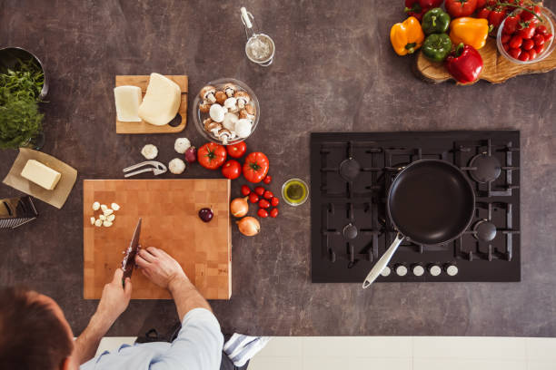 istock Cutting purple onion for a delicious dish 1184387146
