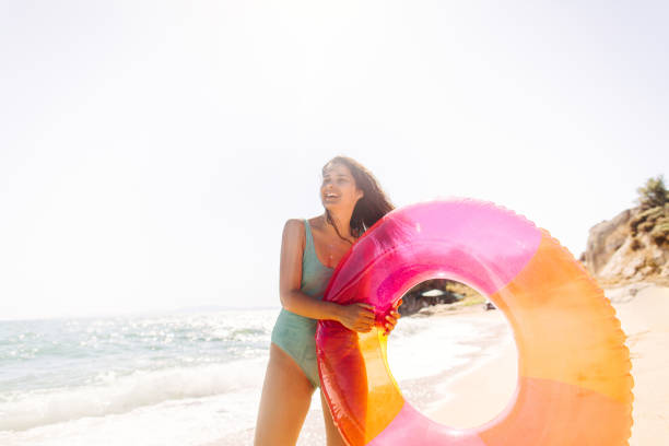 istock Enjoying summer at the beach 1184387151