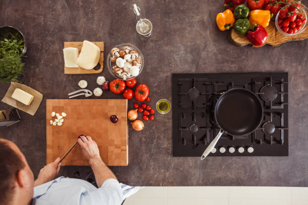 istock Man chopping purple onion 1184387152