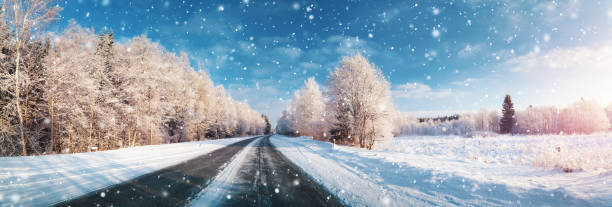 istock winter road, covered with snow on sunny day 1184389201