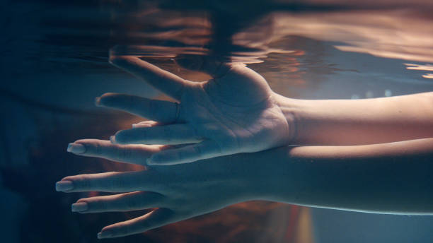 istock Shy, sensual touch. Underwater romance 1184389454