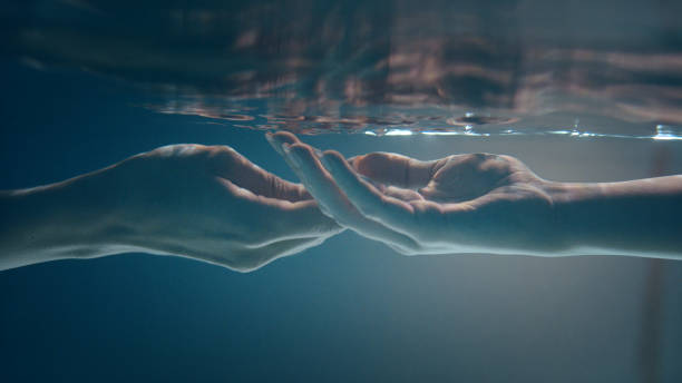 istock Shy, sensual touch. Underwater romance 1184389464