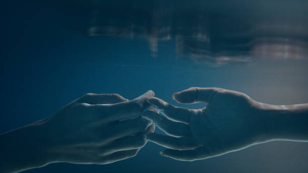 istock Shy, sensual touch. Underwater romance 1184389489