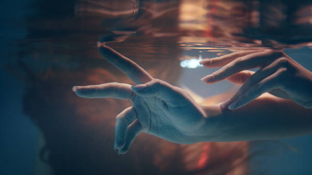 istock Shy, sensual touch. Underwater romance 1184389503
