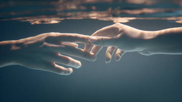 istock Shy, sensual touch. Underwater romance 1184389522