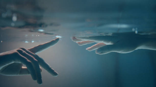 istock Shy, sensual touch. Underwater romance 1184389523