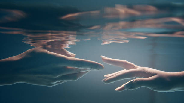 istock Shy, sensual touch. Underwater romance 1184389546