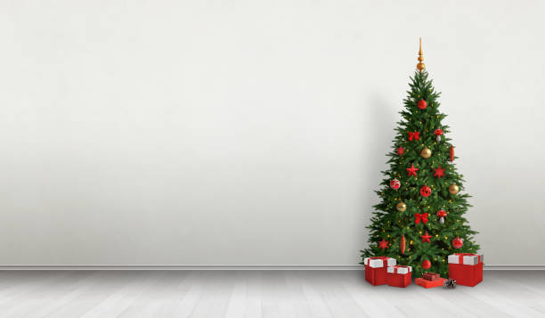 istock Decorated Christmas tree in room. Copy space beside on wall for greeting text. 1184390025