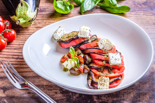 istock Eggplant salad with tomatoes and feta cheese. 1184391789