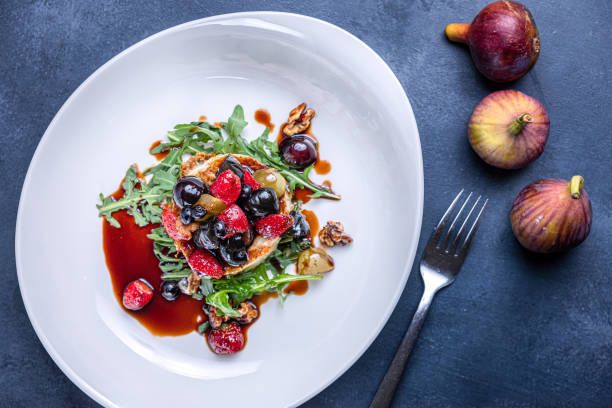 istock Grilled camembert cheese with berry salad. 1184392176
