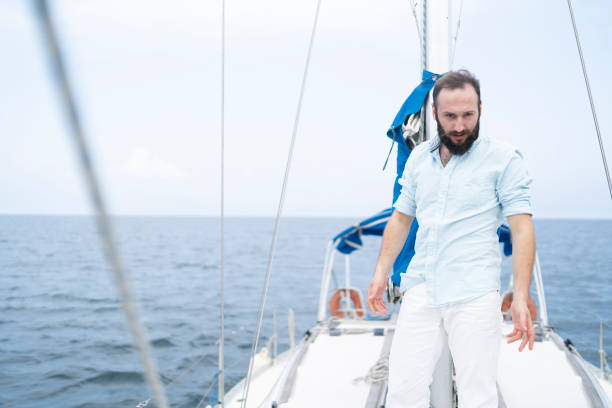 istock Captain standing on yacht 1184393226