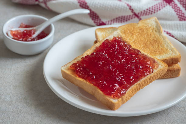 istock Toast bread with strawberry jam on plate 1184393519