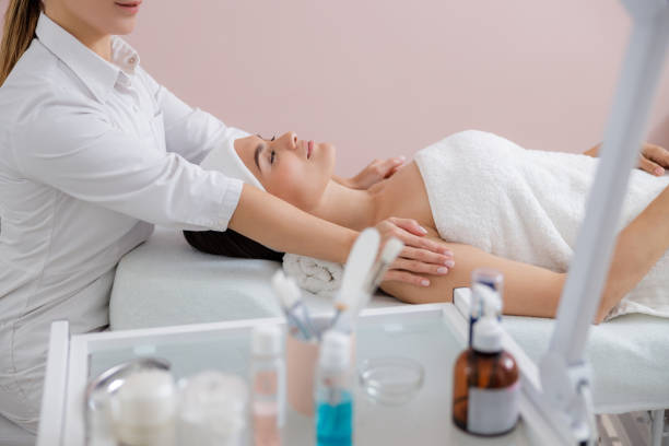 istock Beautiful young woman having massage at spa salon 1184393815