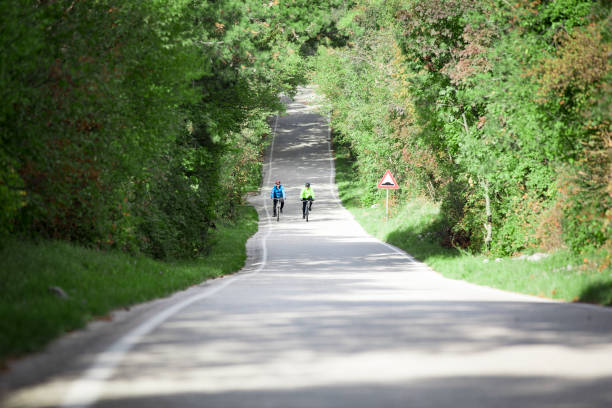 Cyclers on Single Lane Country Road.