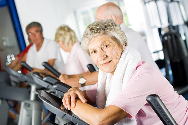 istock Group of older people using gym equipment 118439593