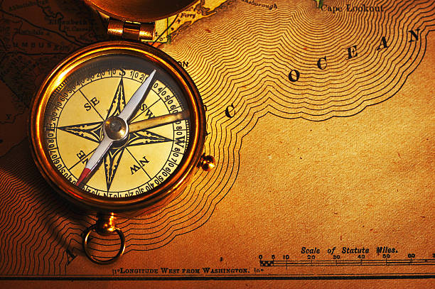 istock Antique brass compass over old USA map 118439758