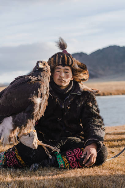 istock Portrait of eagle hunter near the river  in Mongolia 1184398215